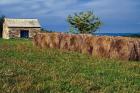 Large Round Haybales With Stone Barn