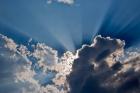 Sunbeams streaking through clouds, Masai Mara, Kenya