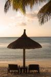 Mauritius, Beach scene, umbrella, chairs, palm fronds
