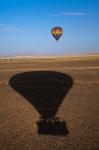 Hot air balloon casting a shadow over Namib Desert, Sesriem, Namibia
