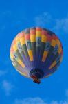 Rainbow colored hot air balloon over Namib Desert, Sesriem, Namibia