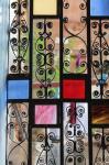 Africa, Tanzania, Zanzibar, Stone Town. Stained glass and iron door.