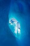 Antarctica, Iceberg framed in arch of another in Wilhelmina Bay.