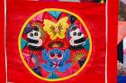 China, Beijing. Chinese handicrafts. Colorful Chinese embroidery quilt
