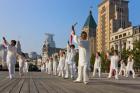 People practicing Taiji with sword on the Bund in the morning, Shanghai, China
