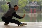 Man Doing Tai Chi Exercises at Black Dragon Pool with One-Cent Pavilion, Lijiang, Yunnan Province, China