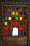 Brightly colored glass window, City Palace, Udaipur, Rajasthan, India.