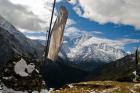 Prayer flags on ridge above Dole, peak of Ama Dablam, Nepa,