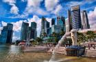 Merlion, symbol of Singapore, and downtown skyline in Fullerton area of Clarke Quay.