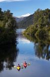 Kayaks, Moeraki River by Lake Moeraki, West Coast, South Island, New Zealand