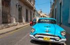 Cuba, Camaquey, Oldsmobile car and buildings