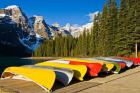 Moraine Lake and rental canoes stacked, Banff National Park, Alberta, Canada