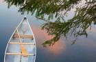 Canada, Quebec, Eastman Canoe On Lake At Sunset