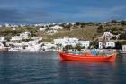 Greece, Cyclades, Mykonos, Hora Harbor view with Greek fishing boat
