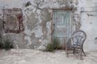 Old Building chair and doorway in town of Oia, Santorini, Greece