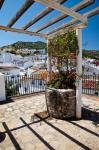 Spain, Andalusia, Cadiz Province Potted plants Overlooking Rooftops