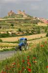 Blue tractor on rural road, San Vicente de la Sonsierra Village, La Rioja, Spain