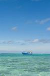 Fishing boat in the turquoise waters of the blue lagoon, Fiji