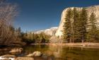 El Capitan towers over Merced River, Yosemite, California