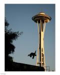 Skateboarder Aloft and Space Needle