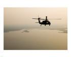 An Air Force helicopter flys over Lake Pontchatrain to New Orleans