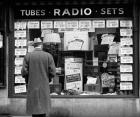 1940s Man Looking At Window Display Of Radios