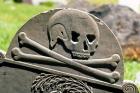 Skull And Crossbones Carved On Tombstone