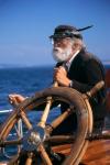 1990S Bearded Man At Wheel Of Ship