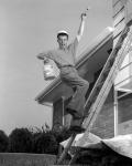 1960s Man Falling Off Of Ladder