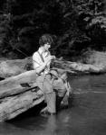 1920s 1930s Woman Sitting On Rock