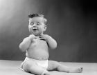 1950s Baby Seated With Eyes Closed