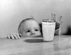 1950s Toddler Reaching Up