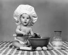 1960s Baby Seated On Checkered Tablecloth