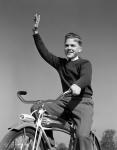 1940s 1950s Smiling Boy Riding Bike Waving