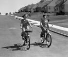 1950s Teen Boy Girl Couple Riding Bikes