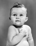 1950s Baby Looking Up Holding Right Hand Over Heart