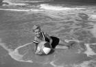 1960s Woman In Bathing Suit Lying In The Surf