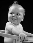 1950s 1940s Baby In High Chair Making Funny Facial Expression