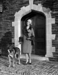 1920s Woman Wearing Fur Coat With German Shepherd Dog