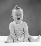 1950s Crying Baby Seated With Distressed Expression?