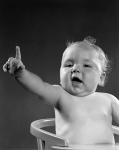 1940s 1950s Baby Sitting In Chair Arm And One Finger Raised