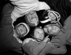 1960s Five Boys In Huddle Wearing Helmets & Football Jerseys