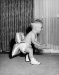 1950sBaby In Diaper And Shoes Learning To Walk