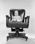 1960s Baby Sitting In Executive Office Chair