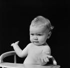 1930s 1940s Baby In High Chair Making Shrugging Gesture