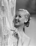 1950s Wet Blonde Woman Peeking Around Shower Curtain