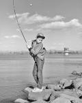 1980s Boy Fishing On Riverbank