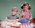 1960s  Boy And Girl Mixing Ingredients For Cookies