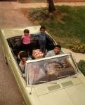 1970s African American Family Seated In Convertible Car