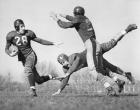 Three Men Playing Football